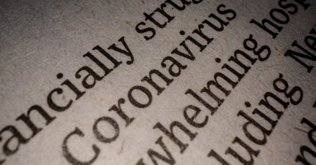What Font Does Jiminy's Journal Use? - Closeup white page of article with black font about coronavirus pandemic research and economy impact