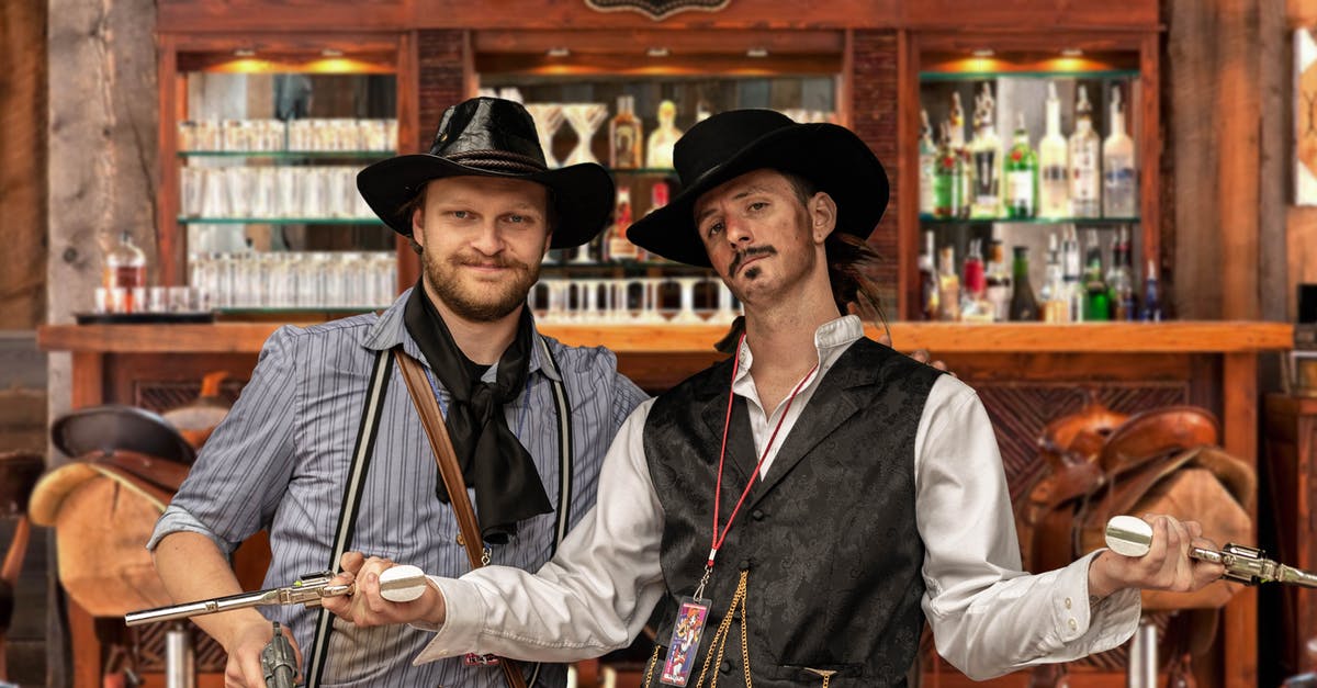 What game does this screenshot of a western saloon/bar belong to? - Two Men Standing Beside Brown Wooden Cabinet What game does this screenshot of a western saloon/bar belong to? - Two Men Standing Beside Brown Wooden Cabinet
