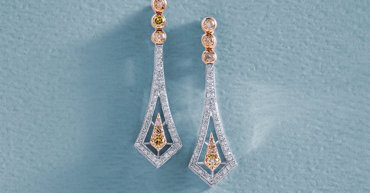 What gems does Lily Roth not sell? - Earrings with Diamonds on Blue Surface