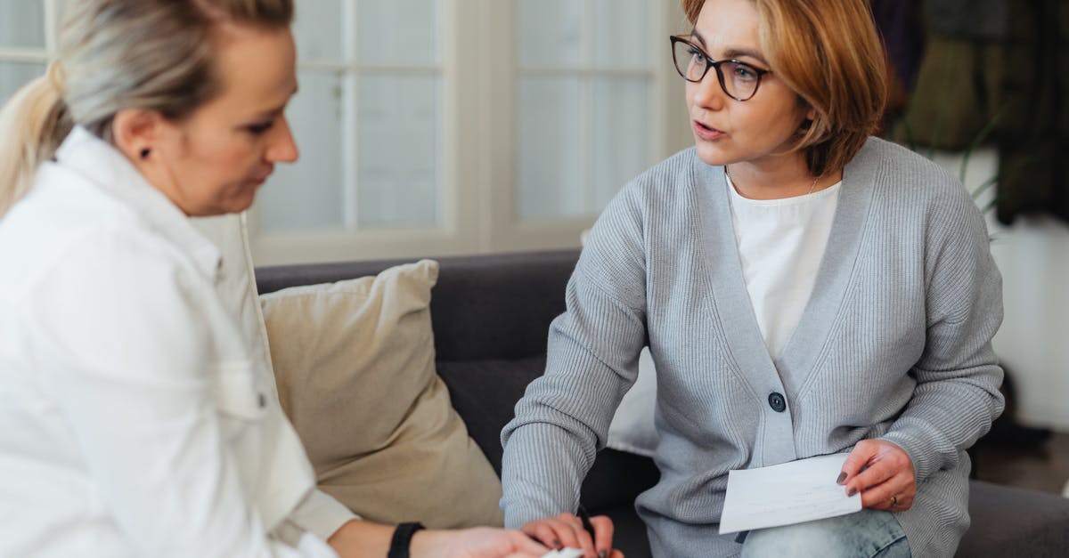 What gives me a penalty for leaving? - Woman Holding Another Womans Hand and Talking to Her What gives me a penalty for leaving? - Woman Holding Another Womans Hand and Talking to Her