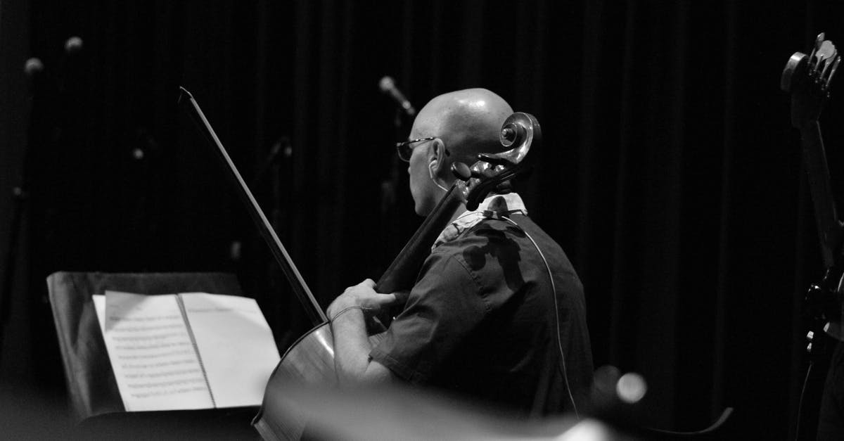 What gunner skills should a bow user avoid? - Black and white back view of male musician in earphone with violoncello and bow against musical notation What gunner skills should a bow user avoid? - Black and white back view of male musician in earphone with violoncello and bow against musical notation