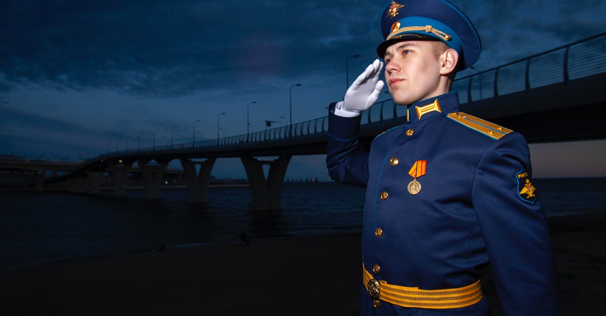 What happens after you earn 2015 service medal CSGO - Military male patriot in uniform near bridge at night