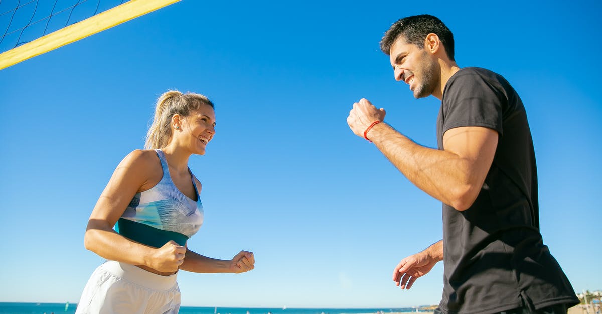 What happens if 2 scoiatel players play each other? - Man and Woman Enjoying a Game of Volleyball