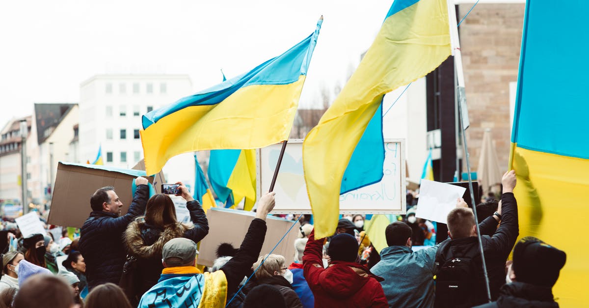 What happens if a naval invasion is repelled? - People Gathering on Street Holding Ukraine Flags What happens if a naval invasion is repelled? - People Gathering on Street Holding Ukraine Flags