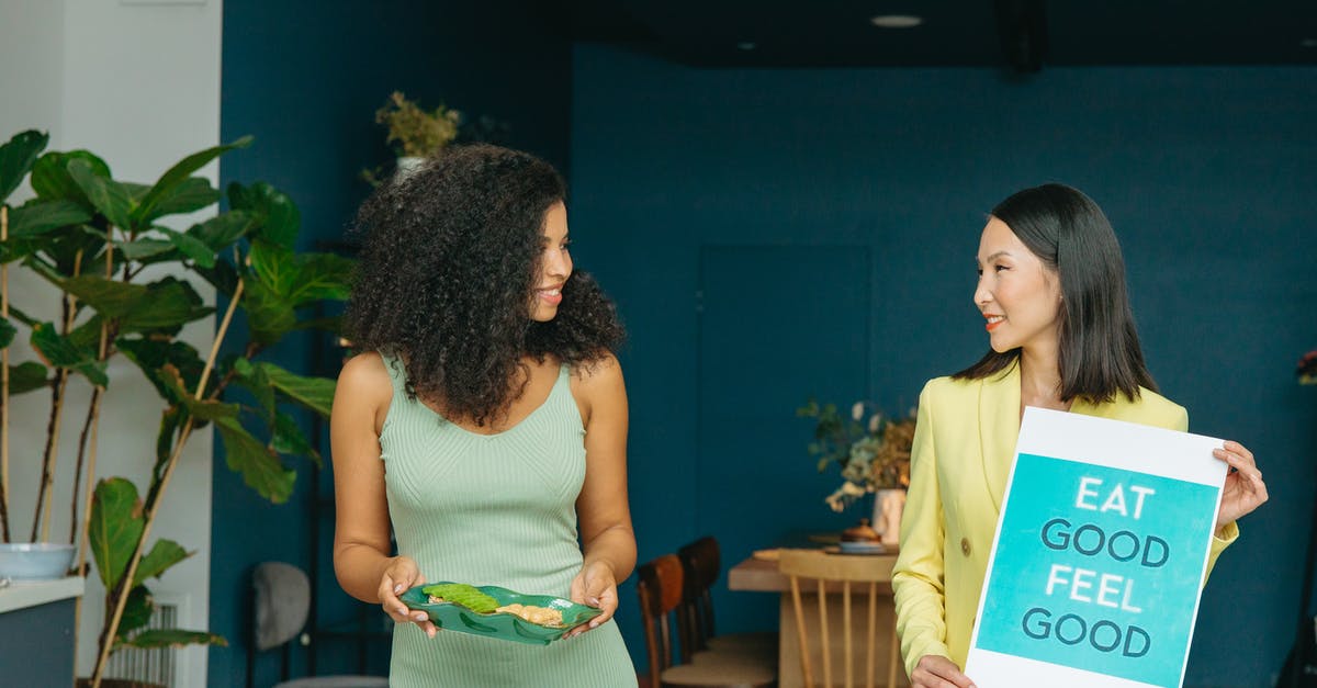 What happens if I lose all three hearts? - Woman in White Tank Top Standing Beside Woman in Green Dress What happens if I lose all three hearts? - Woman in White Tank Top Standing Beside Woman in Green Dress
