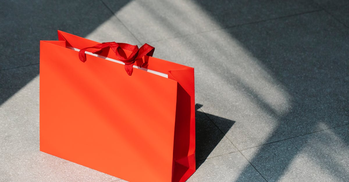 what happens if you can't afford to buy a new ship? - Red paper shopping bag on gray ground