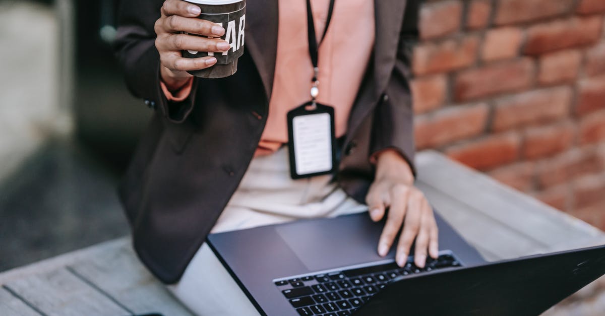 What happens if you delete your Nintendo Network ID, and where do the badges go? - Crop businesswoman with laptop and coffee