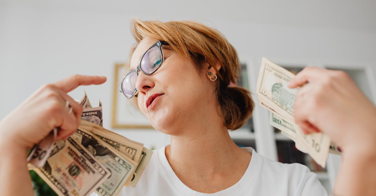 What happens if you don't have enough money to repair? - Woman in White Crew Neck Shirt Holding Dollar Bills