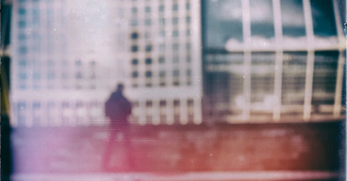 What happens to aliens and items outside of captured UFOs? - Film Photography of aMan and Buildings