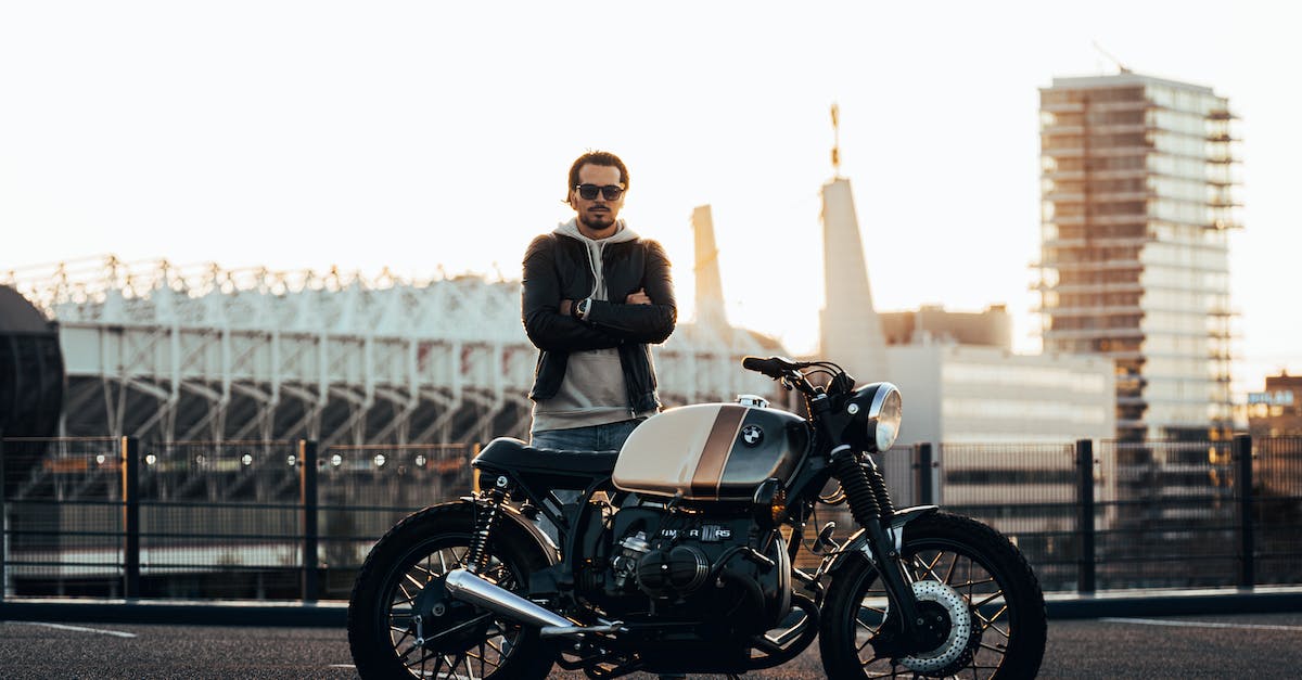 What happens to custom vehicles if the impound lot is full? - Man Standing Beside Motorcycle