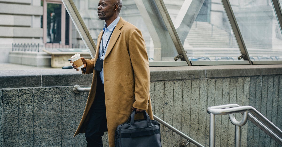 What happens to Pokémon you leave in Pokémon Go Gyms? - Contemplative black businessman leaving metro station