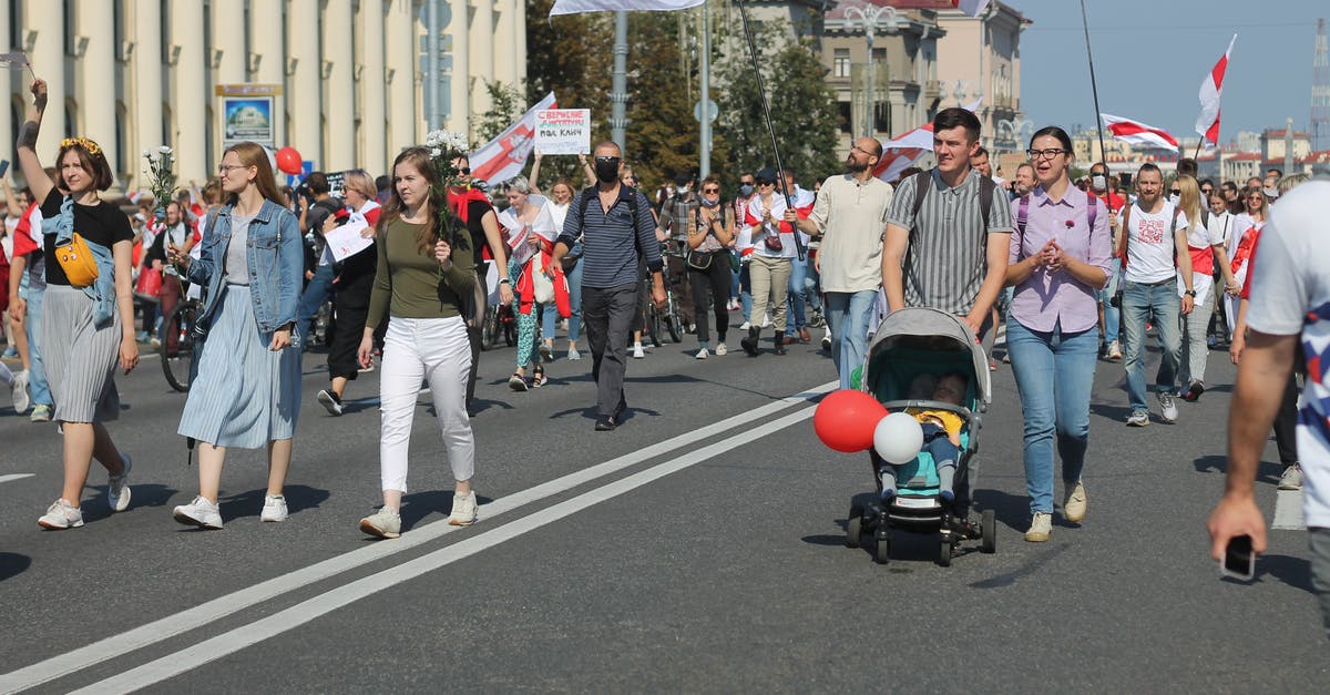 What happens to the investments into my city if I join another one? - A Family with Their Baby Joining a Protest What happens to the investments into my city if I join another one? - A Family with Their Baby Joining a Protest
