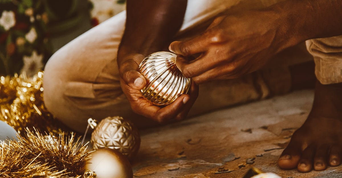 What happens when Frog picks up a golden weapon? - Person Holding Gold Round Ornament