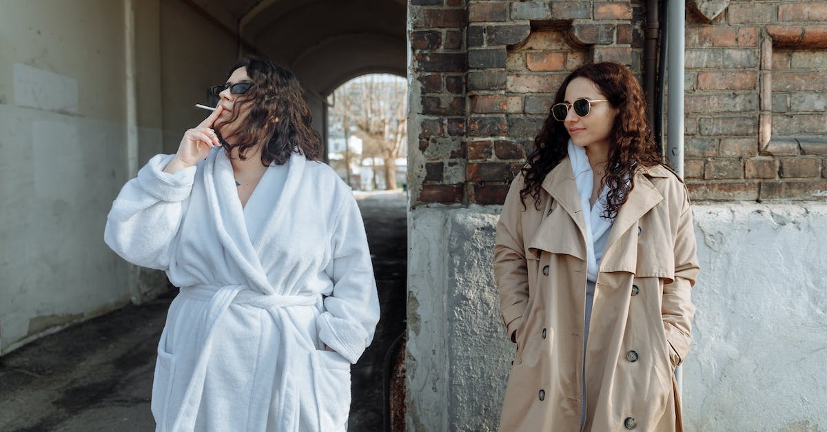 What happens when I upgrade a boosted building? - Woman in White Coat Standing Beside Gray Concrete Wall What happens when I upgrade a boosted building? - Woman in White Coat Standing Beside Gray Concrete Wall