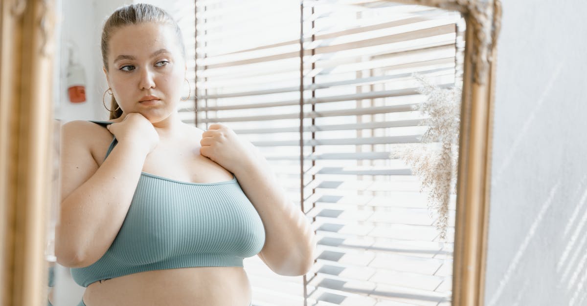 What happens when my Dota Plus subscription ends? - Woman in Teal Bikini Top and White Panty Standing Near Window