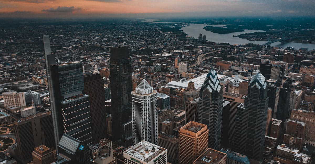 What happens when one reaches the center of the universe? - Aerial view of modern apartment building with One Liberty Plaza located in business area of New York