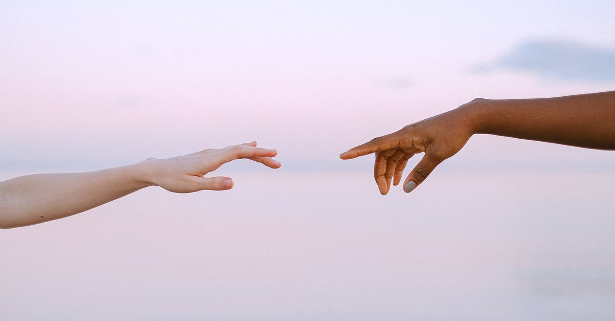 What happens when you reach the 25th spray? - Photo Of People Reaching Each Other's Hands