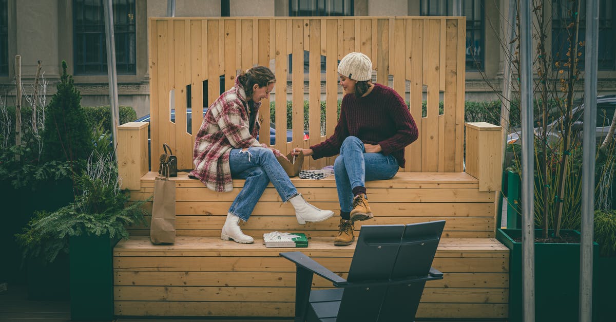 What happens with excess items if my bag is full, and what should I do to avoid losing items? - Positive women on wooden bench with handbag What happens with excess items if my bag is full, and what should I do to avoid losing items? - Positive women on wooden bench with handbag