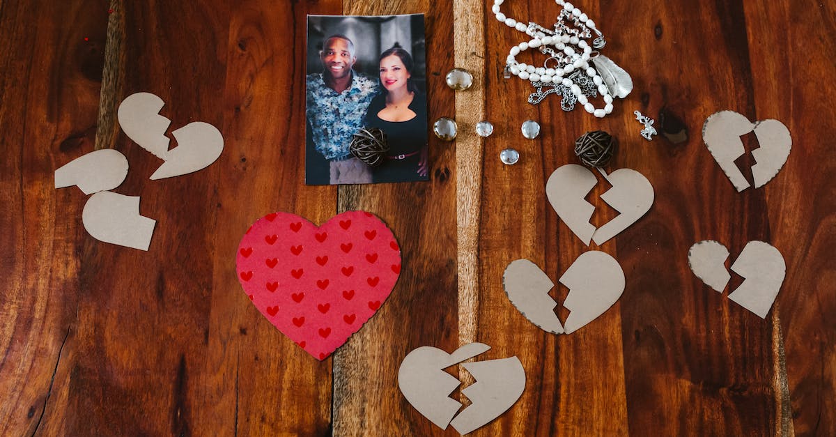 What heart pieces are unavoidable? - A Photo of a Couple and Paper Cutouts of Broken Hearts