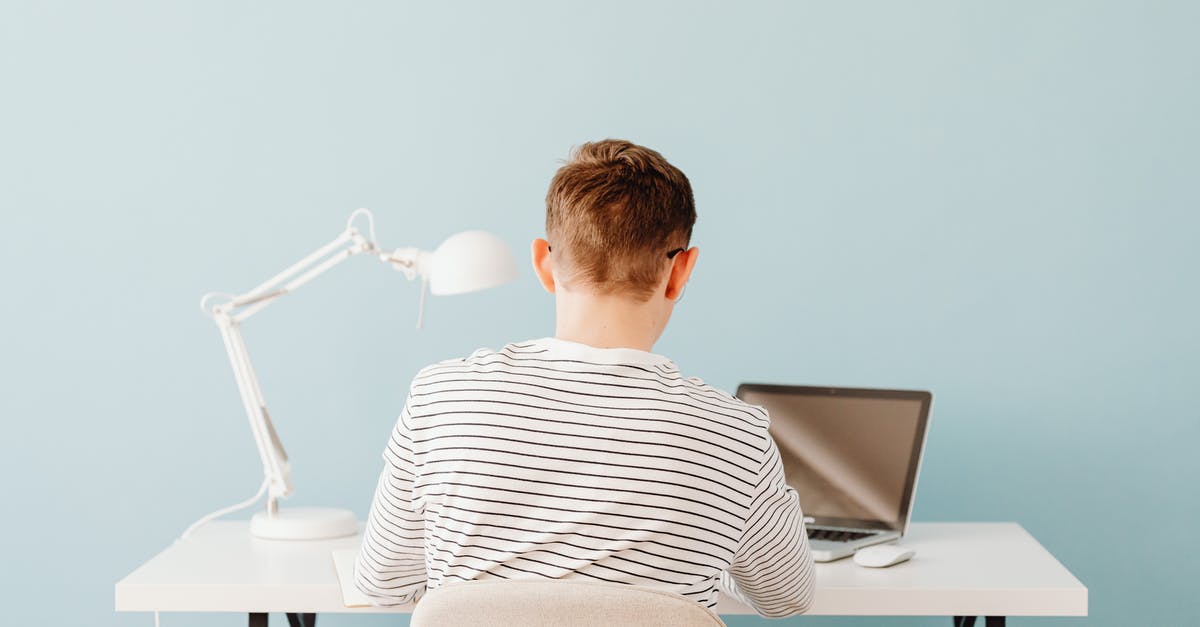 What if I use a boy with its hidden ability and a genderless Pokemon [duplicate] - Back of a Teenager Using a Laptop at a Desk