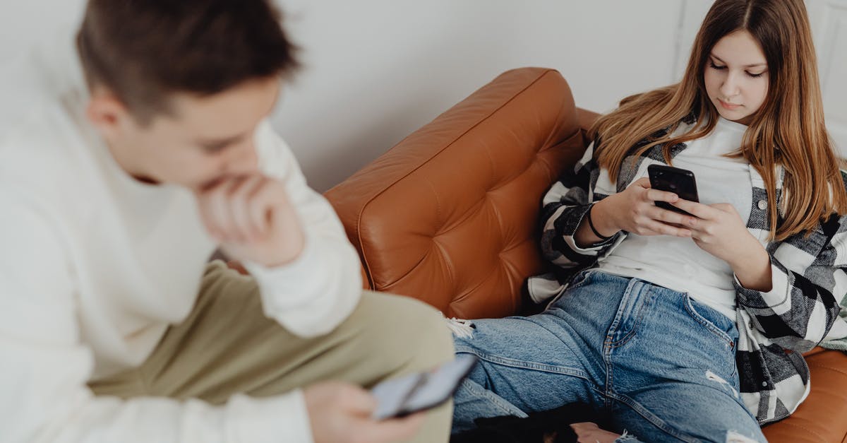 What if I use a boy with its hidden ability and a genderless Pokemon [duplicate] - Teenage Boy and Girl Sitting on a Couch and Using Smartphones 