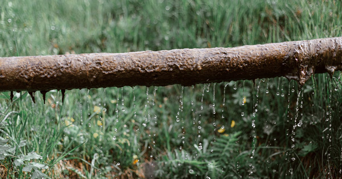 What influences the availability in the settlements supply line target selection? - Rusted metal leaking pipe above grassy meadow What influences the availability in the settlements supply line target selection? - Rusted metal leaking pipe above grassy meadow