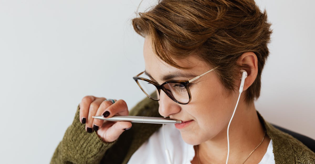 What is a Silver Statue good for? - Content woman with earphones and stylish pen