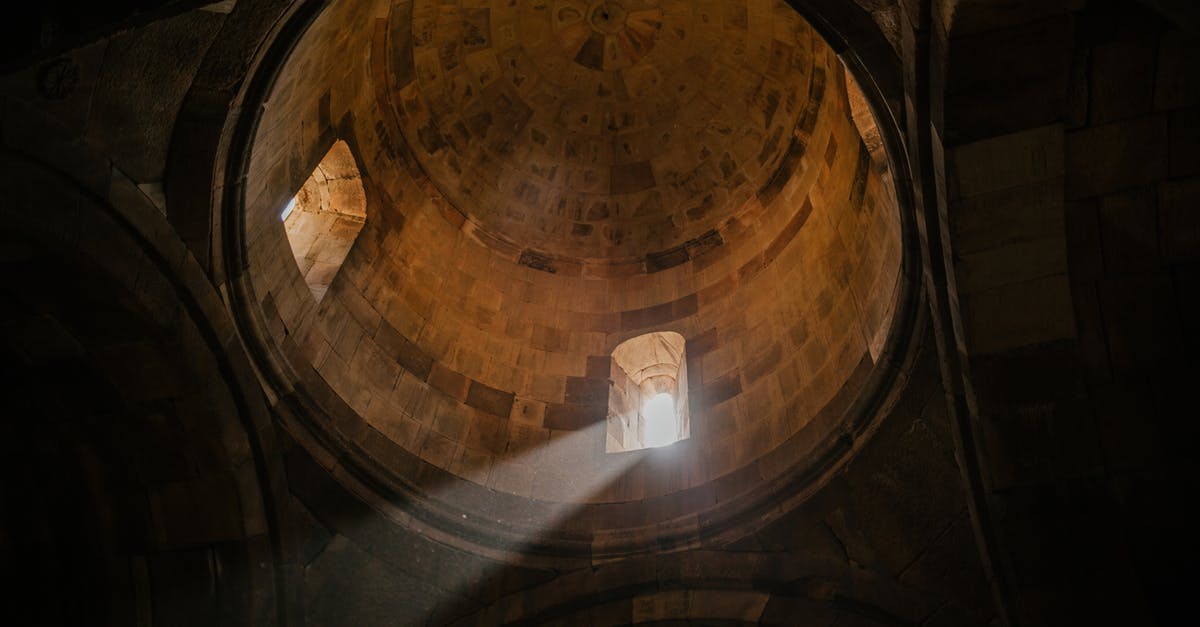 What is a Whispers of the Old Gods pack? - From below of bright sunshine illuminating through window of dome in ancient stone cathedral