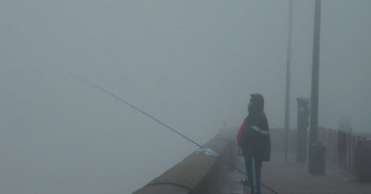 What is best experience level for enchanting fishing rod - Man in Black Jacket and Black Pants Walking on Sidewalk What is best experience level for enchanting fishing rod - Man in Black Jacket and Black Pants Walking on Sidewalk