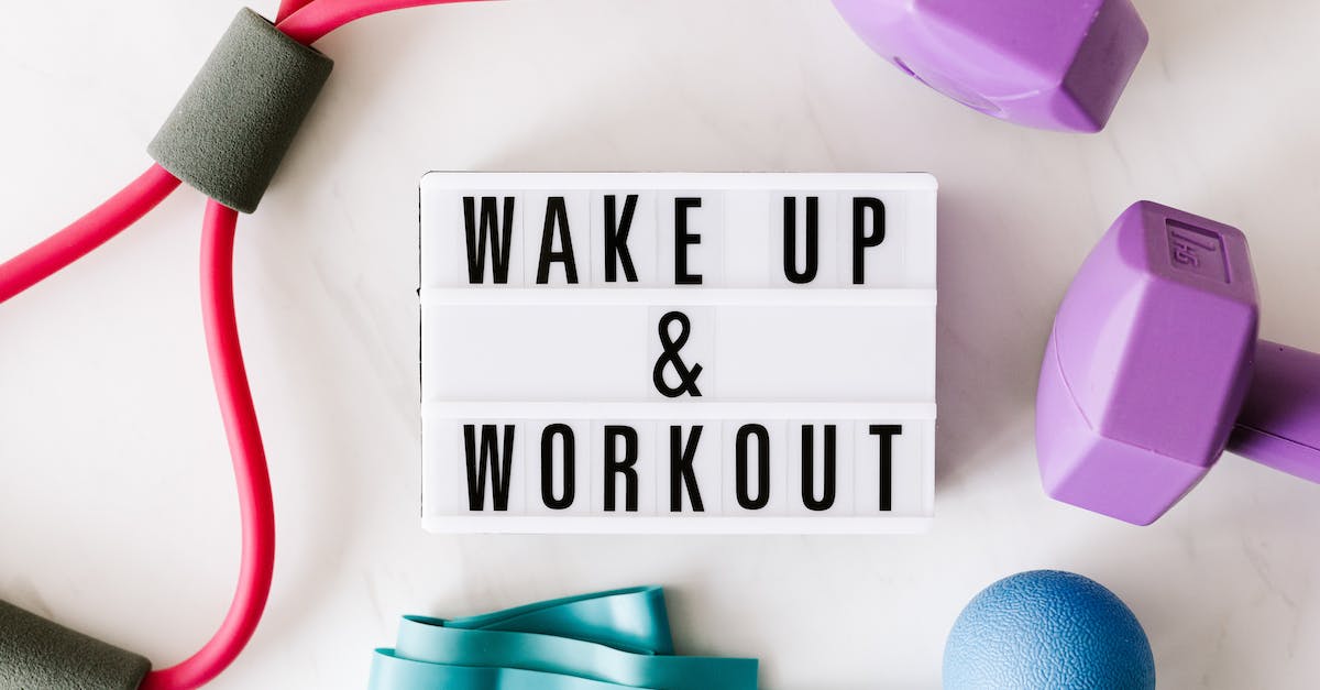What is called "maximum carry weight" in the formula for strength advancement - Wake up and workout title on light box surface surrounded by colorful sport equipment
