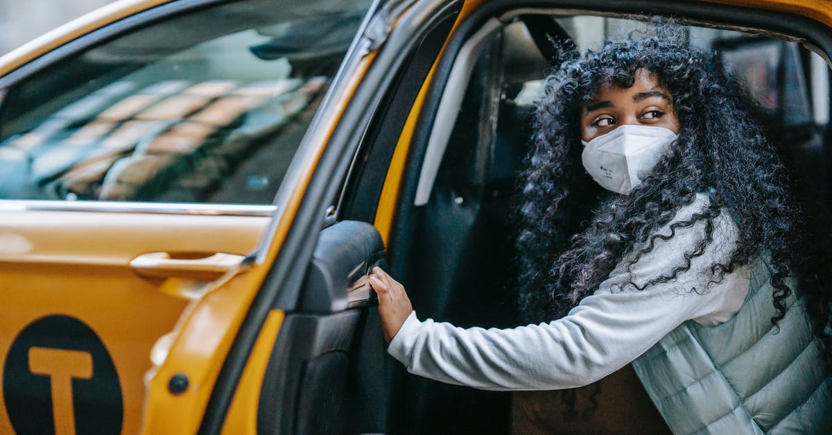 What is considered a normal car? - Black female getting out of taxi during coronavirus What is considered a normal car? - Black female getting out of taxi during coronavirus
