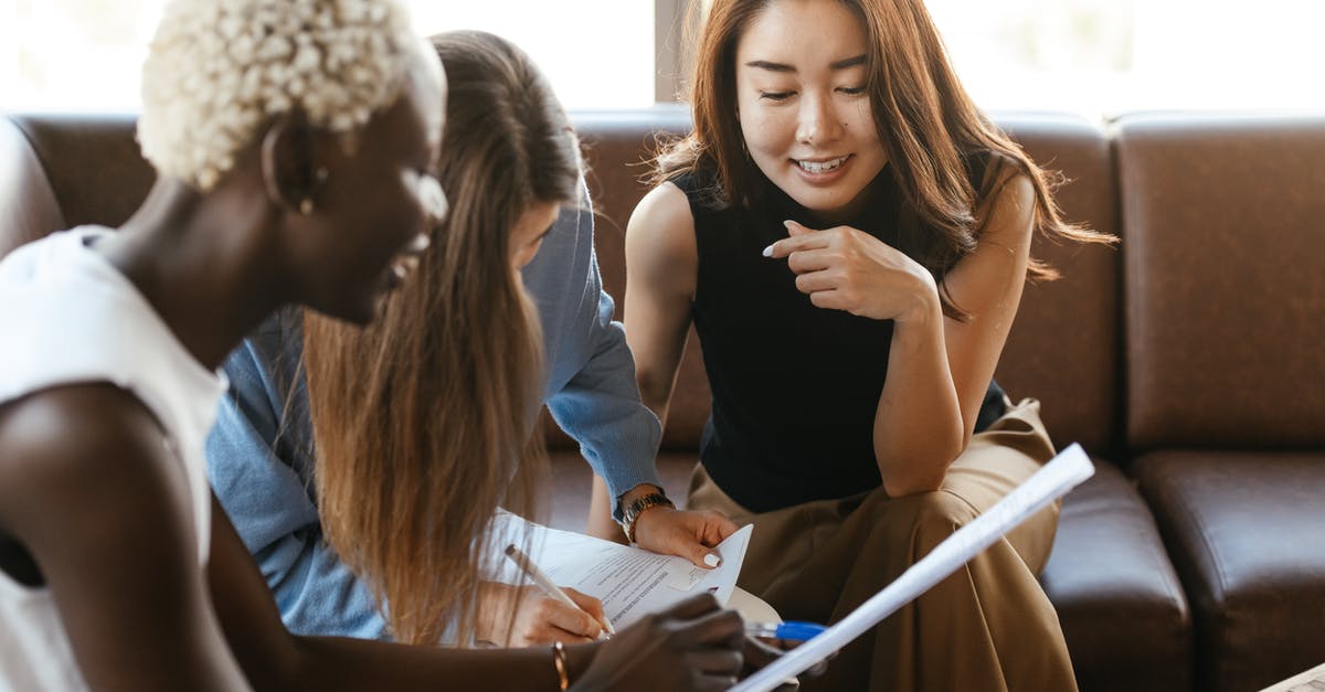 What is CP? Why is it important? - Multiethnic cheerful colleagues talking about job and working with documents What is CP? Why is it important? - Multiethnic cheerful colleagues talking about job and working with documents