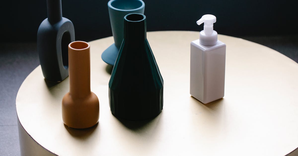 What is more efficient - Liquid XP from OpenBlocks or Mob Essence from MFR? - From above of white pump bottle of cosmetic lotion placed on round table near set of elegant vases of various shapes