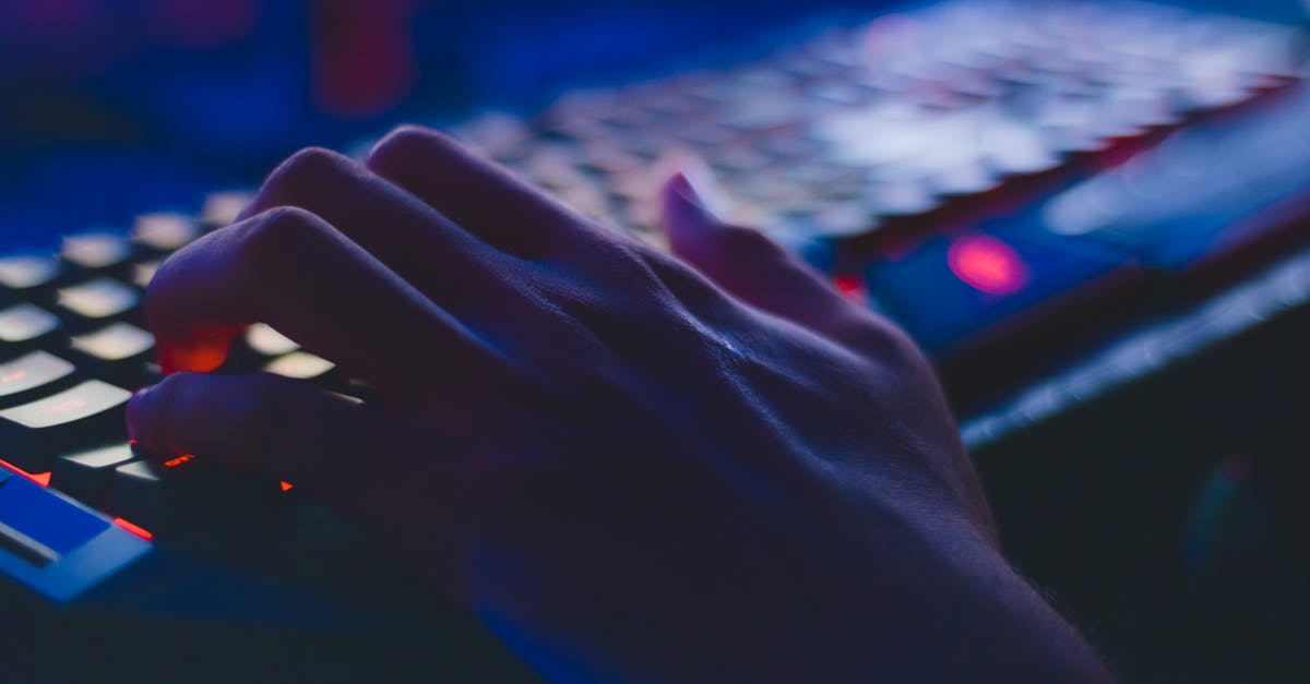 What is name of this pc sword game? - Photo of Person Typing on Computer Keyboard