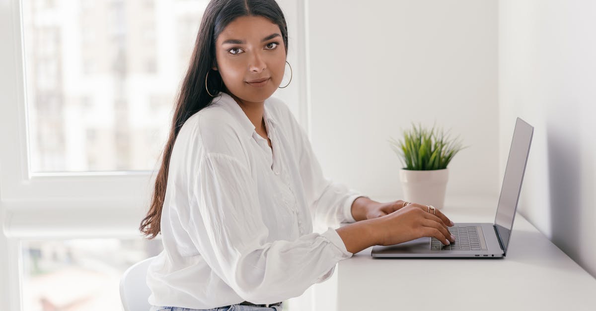 What is "CHAD" in the context of Albion Online? - Woman in White Dress Shirt and Blue Denim Jeans Sitting on White Chair