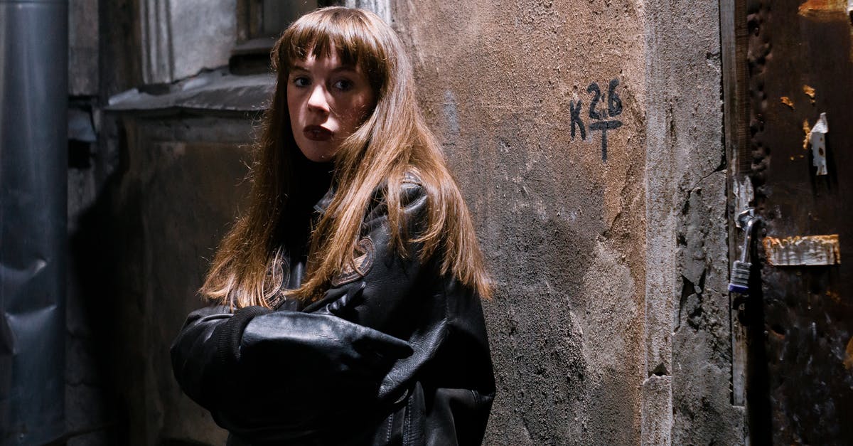 What is the average number of chests that generate per mineshaft? - Millennial female adolescent in casual wear with crossed arms looking at camera near aged concrete construction in town