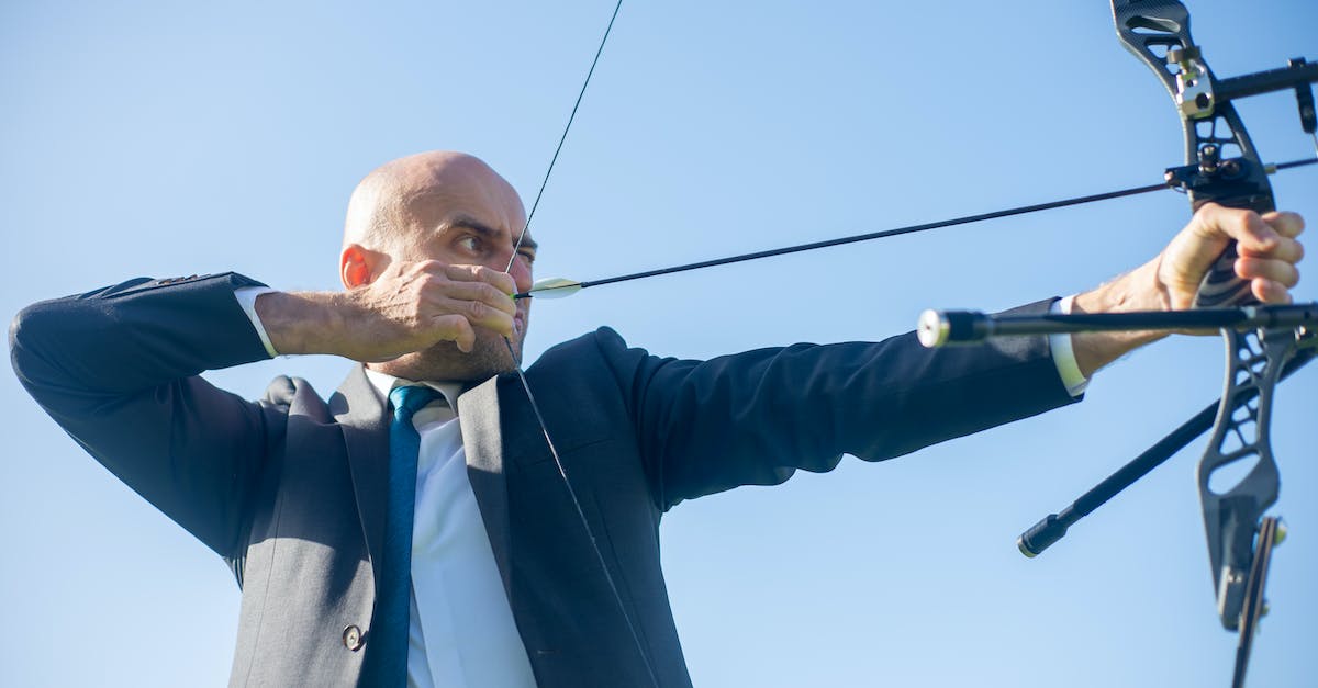 What is the best angle for an enderpearl if I am aiming for distance? - Man aiming Archery Bow and Arrow 