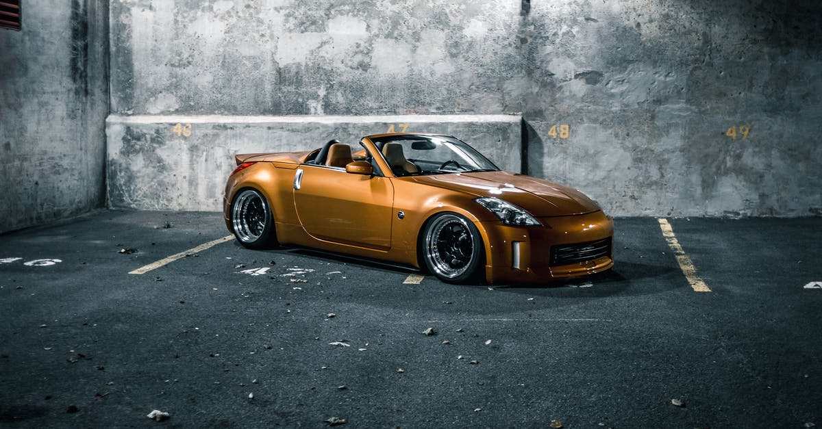 What is the best car and tuning setup for the career races? - Modern racing car on pavement near shabby wall at night What is the best car and tuning setup for the career races? - Modern racing car on pavement near shabby wall at night