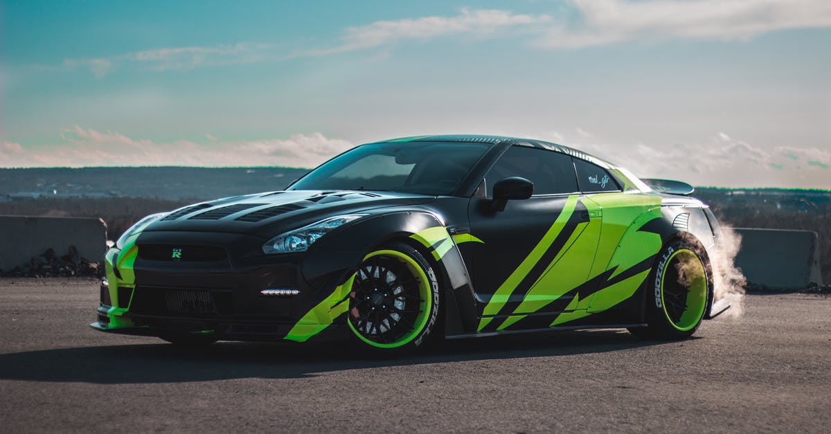 What is the best car and tuning setup for the career races? - Modern tuned sports car with tinted windows drifting on asphalt road against cloudy blue sky What is the best car and tuning setup for the career races? - Modern tuned sports car with tinted windows drifting on asphalt road against cloudy blue sky