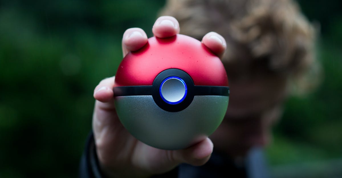 What is the best method for catching Shiny Pokemon in Pokemon Moon? - Person Holding Pokemon Ball Toy