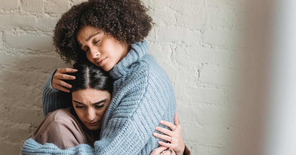 What is the best second lane for a support main? [closed] - Sad African American woman with closed eyes hugging and consoling depressed female friend near white wall in light room at home