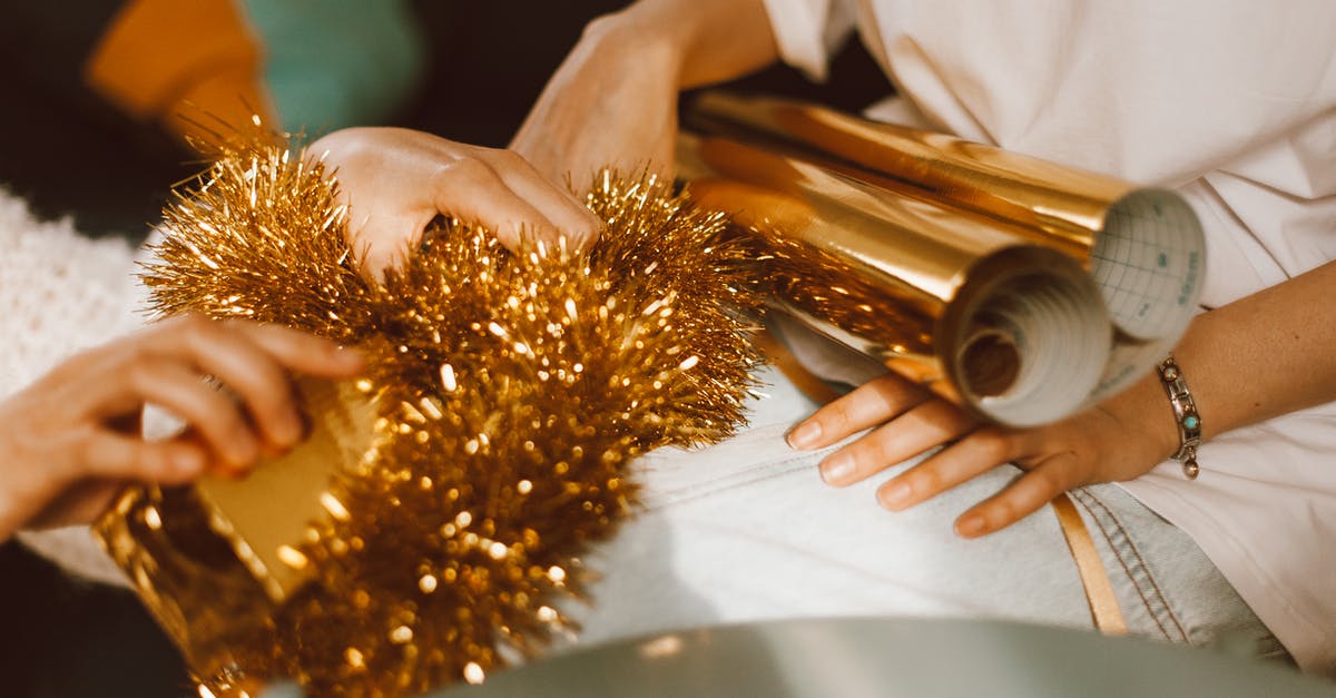 What is the best use for gold in Minecraft? - Person in White Shirt Holding Gold and Silver Makeup Brush