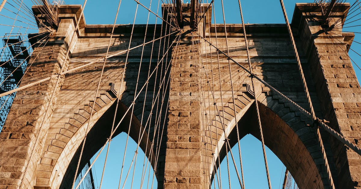 What is the best way to obtain a ridiculously high score in Goat City Bay? - Low angle of famous Brooklyn brick arches with ropes on top of bridge in metropolis What is the best way to obtain a ridiculously high score in Goat City Bay? - Low angle of famous Brooklyn brick arches with ropes on top of bridge in metropolis