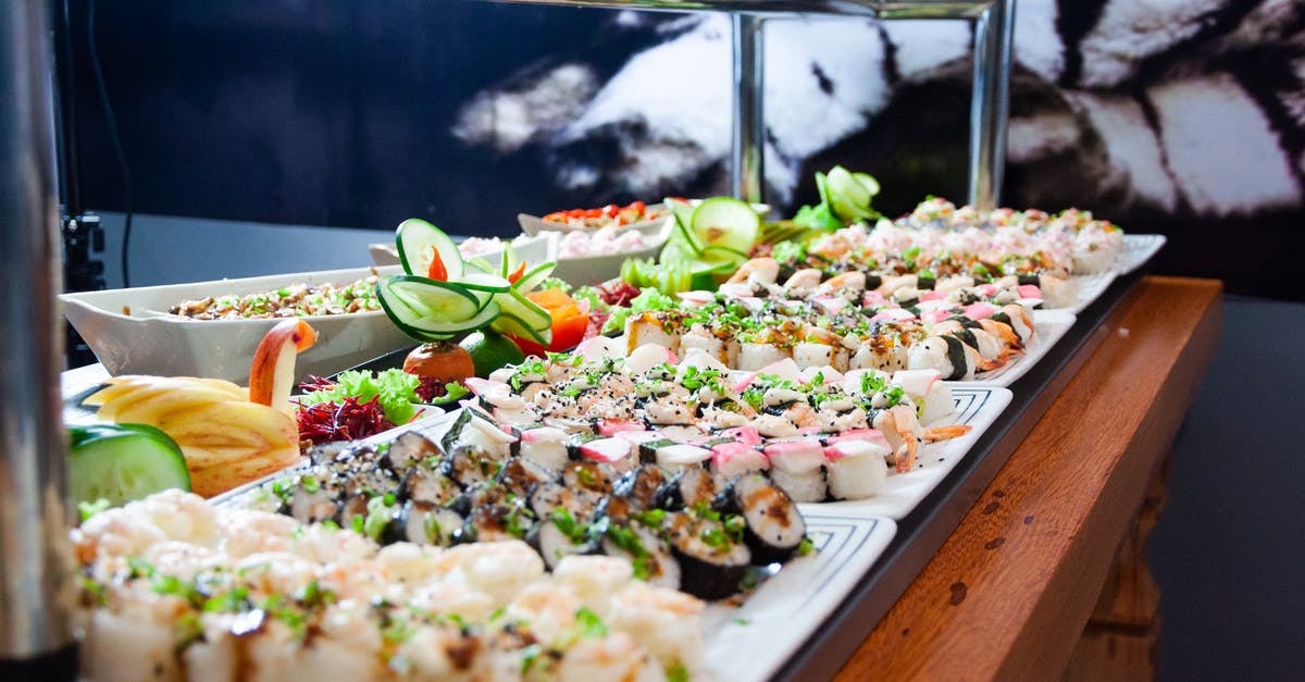 What is the best way to set up MasterWork Dwarf Fortress on Linux? - Sushi on White Plates on Brown Wooden Table