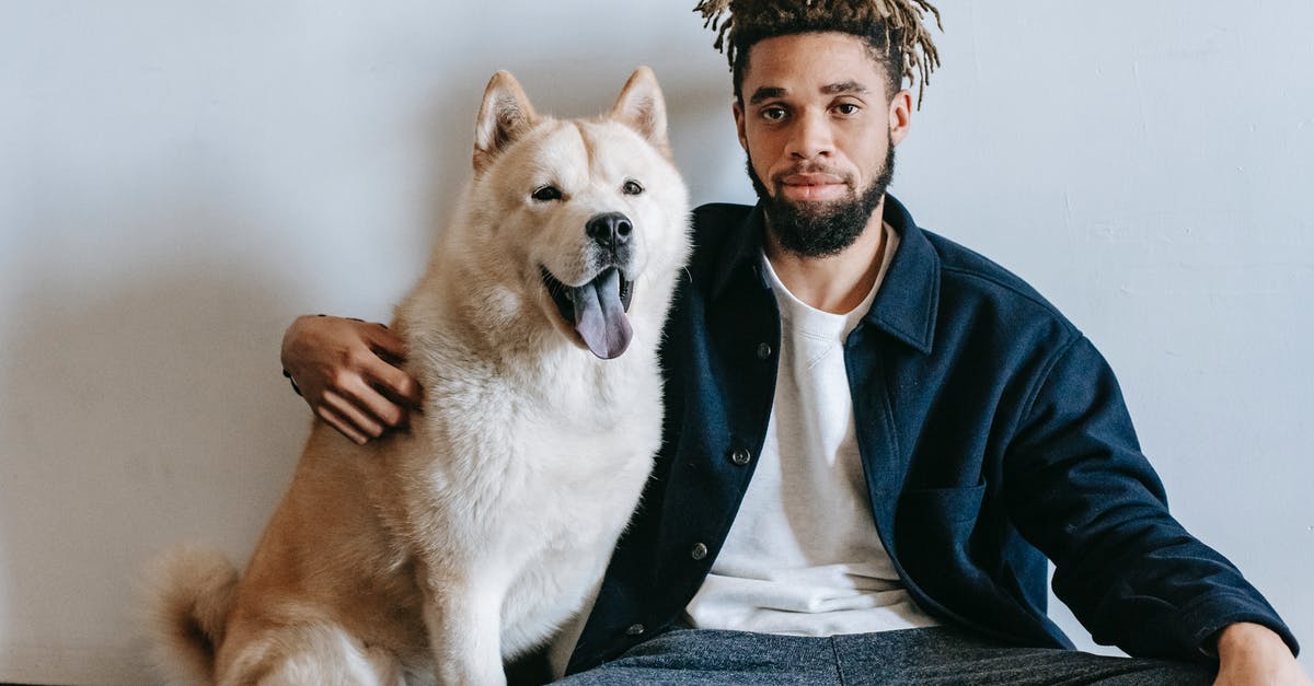 What is the chance of a Sacrifice Room to appear on a floor? - Tranquil African American man in casual clothes sitting on floor and embracing Akita Inu against white wall in apartment What is the chance of a Sacrifice Room to appear on a floor? - Tranquil African American man in casual clothes sitting on floor and embracing Akita Inu against white wall in apartment