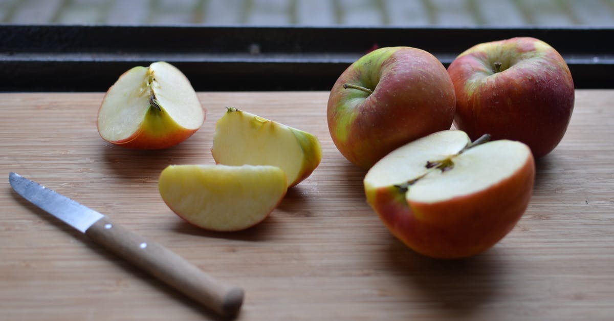 What is the chance to find a pokemon at a spot with green leaves? - Board with slices of fresh apples and knife near window