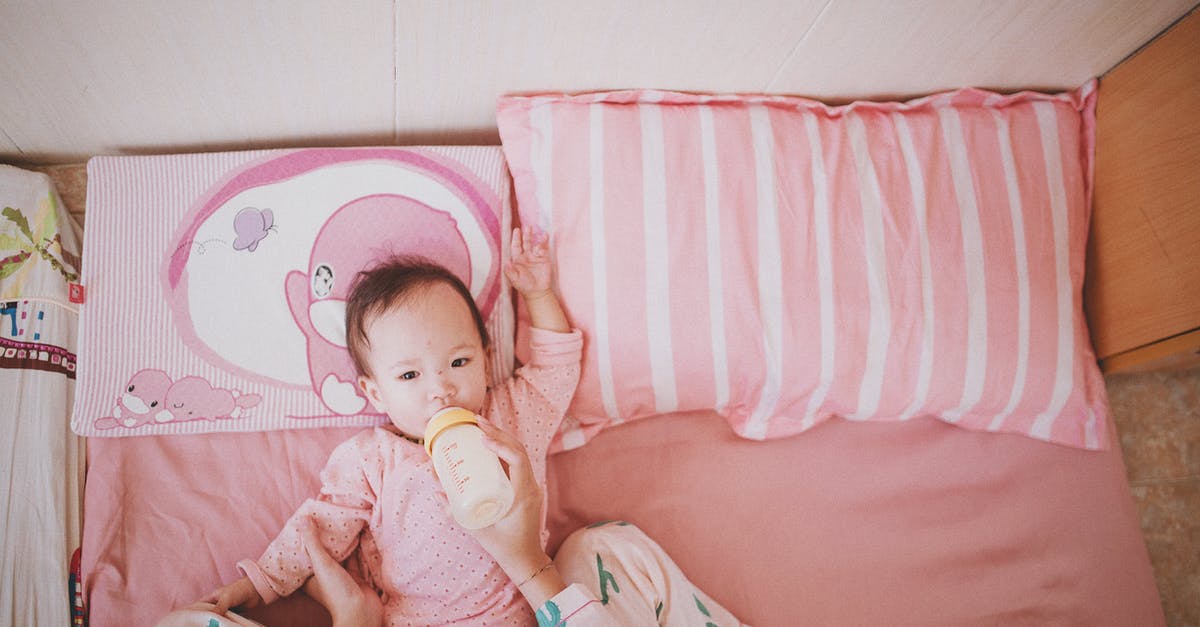 What is the cooldown time for feeding berries to ally Pokémon? - Person Holding and Milk Bottle Feeding a Baby Lying on Bed