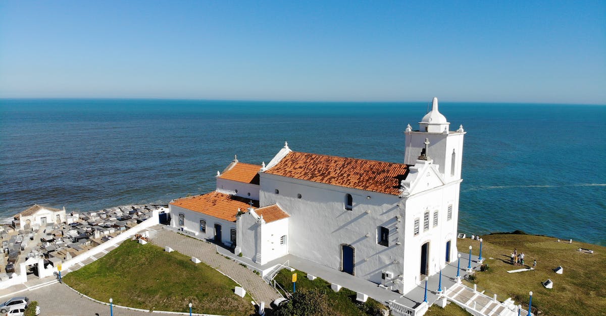 What is the cost per level progression in the game? - White Concrete Building Near Sea