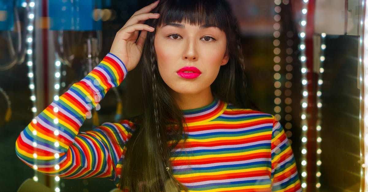 What is the difference between blue and striped blue-and-white defeated levels? - Woman with Full Bangs Wearing Orange and Blue Striped Long Sleeve Shirt