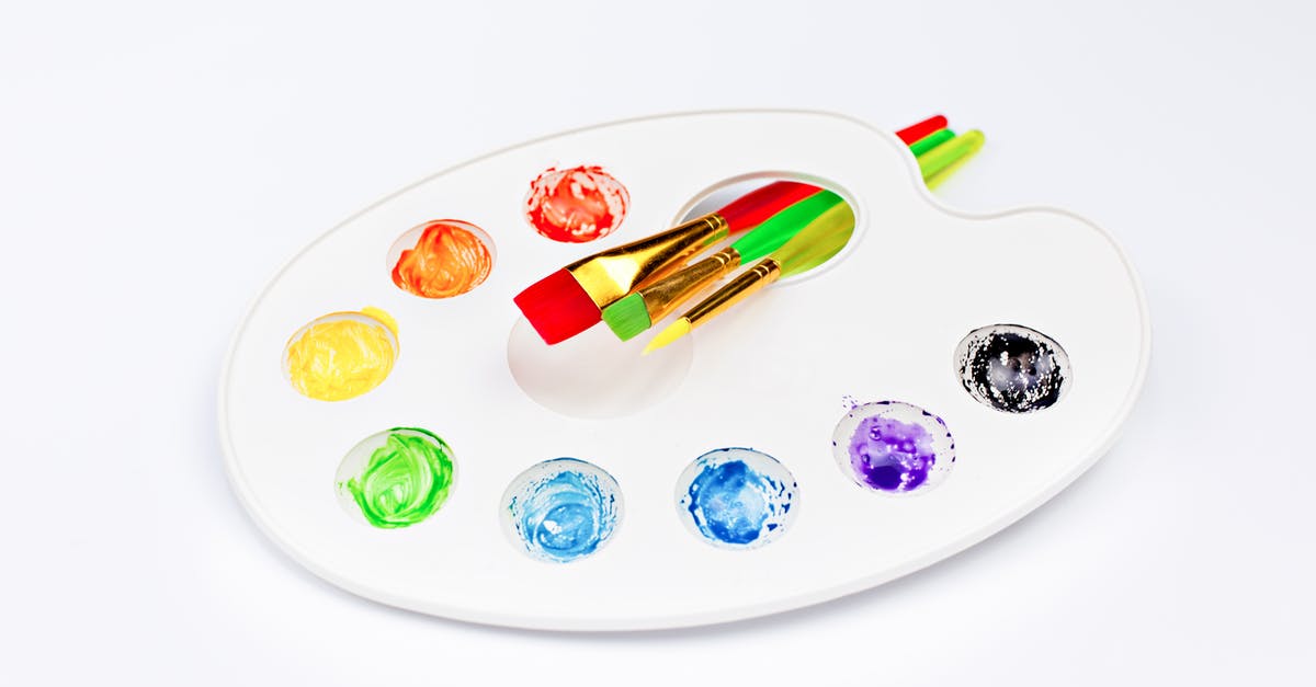 What is the difference between Intense Rainbow dye and normal rainbow dye? - Palette with bright watercolors and brushes placed on white surface